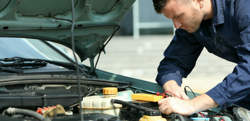mechanic working on a car
